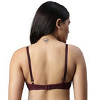 Woman wearing a wine bra on a white background