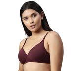 Woman wearing a wine bra on a white background