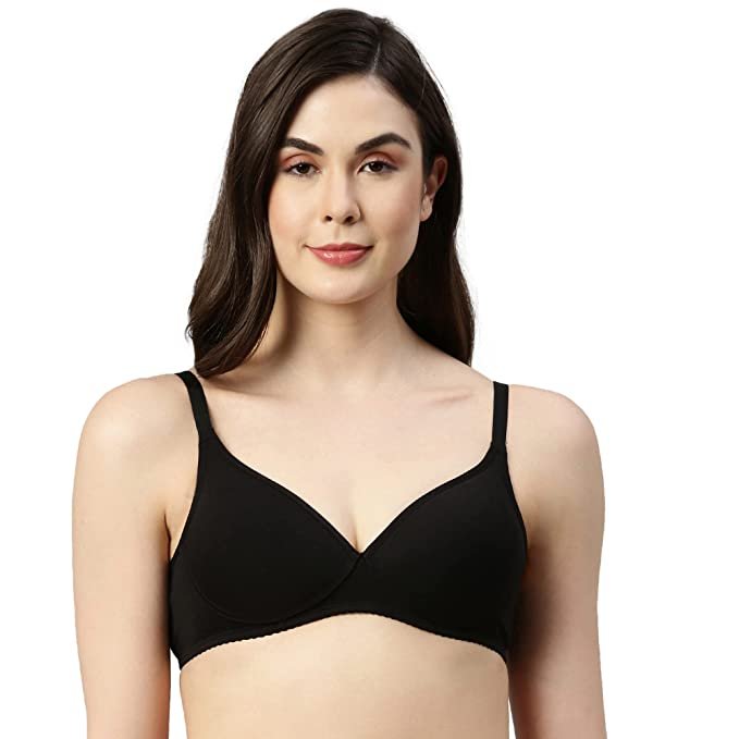 Woman wearing a black bra on a white background
